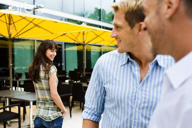 6 Steps to Make You a Flirting Target Men flirting with woman on street