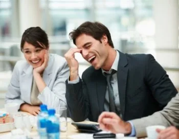 6 Tips to Boost Your Brainpower at Work Business executive enjoying a laugh during a boardroom meeting
