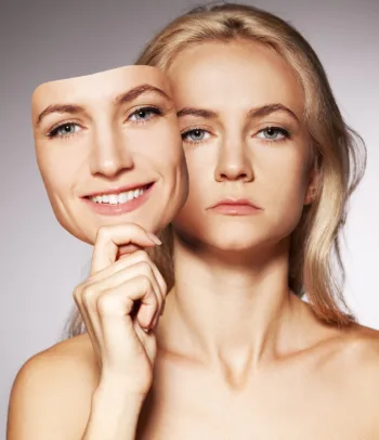 5 Regrets of the Dying - bigstock Woman hiding under the happy m 110513 1
