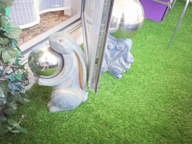 How to Turn Your Balcony Into a Private Sanctuary Bunny and squirrel sculptures / doorstops