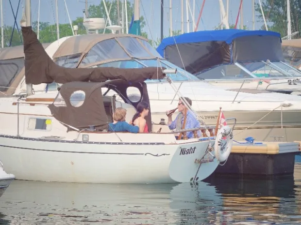 My hubby, brother, and his girlfriend on his sailboat, with me and my parents not far behind