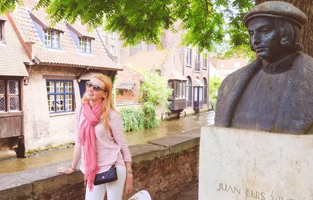 A Visual Tour of Belgium Hanging in Bruges, next to a statue of Juan Luis Vives, the "father" of modern psychology