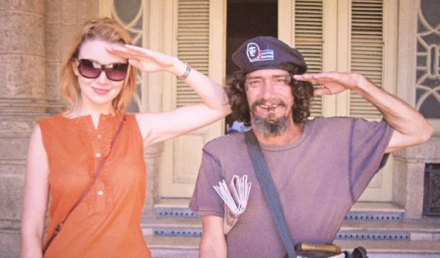 Joking around with a local (yes, those sunglasses were in style at the time!)