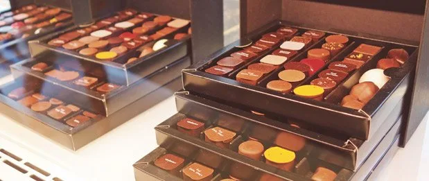 A Foodie's Tour of Belgium Pierre Marcolini jewel box chocolates behind the counter