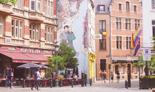 A Visual Tour of Belgium Street art featuring TinTin. Buildings in the art match the street it's on.