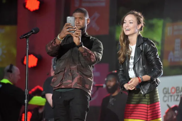 Olivia Wilde with Usher on stage at the Global Citizen Festival