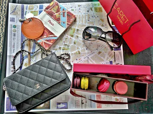 A Guide to Le Marais, Paris The round Hermes-colored key fob, our guides to Paris, French macaroons and my petit Chanel handbag